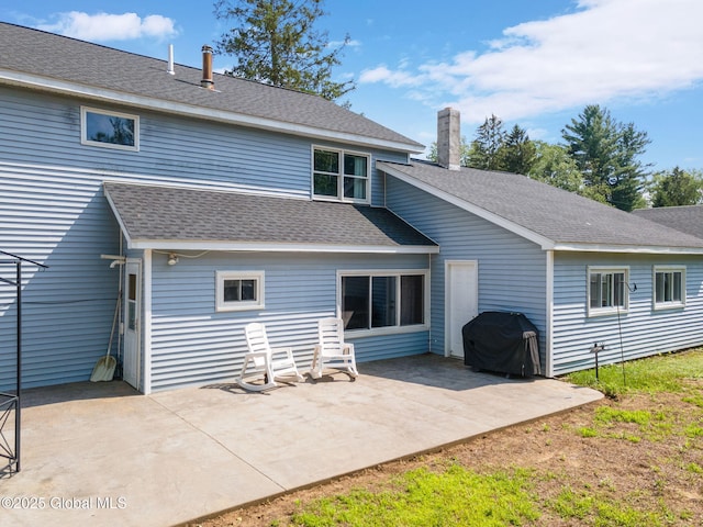 3445 Gari Ln, Guilderland, NY 12303 - back of house featuring a chimney, a patio area, and roof with shingles