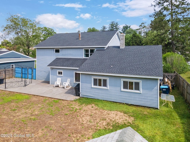 3445 Gari Ln, Guilderland, NY 12303 - back of house featuring a shingled roof, a patio area, a fenced backyard, and a chimney