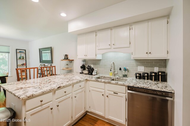 22 Pine Ridge Rd, Stillwater, NY 12866 - kitchen featuring stainless steel dishwasher, a peninsula, backsplash, wood finished floors, and recessed lighting