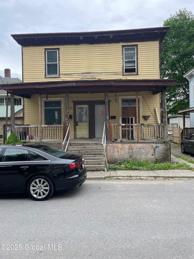 30 Washington St, Fort Plain, NY 13339 - townhome / multi-family property with a porch
