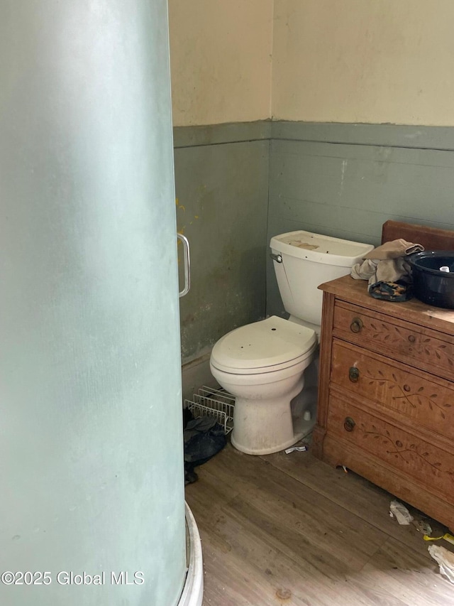 30 Washington St, Fort Plain, NY 13339 - bathroom featuring wood finished floors, a stall shower, and a wainscoted wall