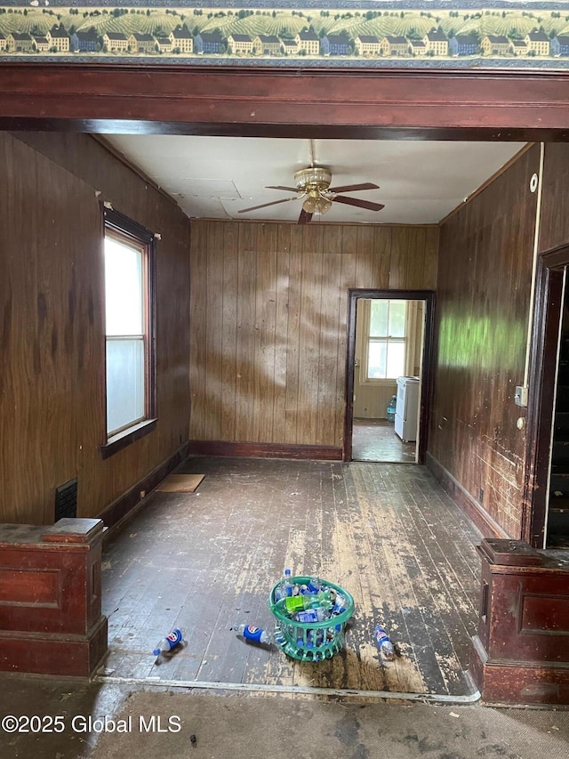 30 Washington St, Fort Plain, NY 13339 - empty room with a ceiling fan, hardwood / wood-style floors, and wood walls