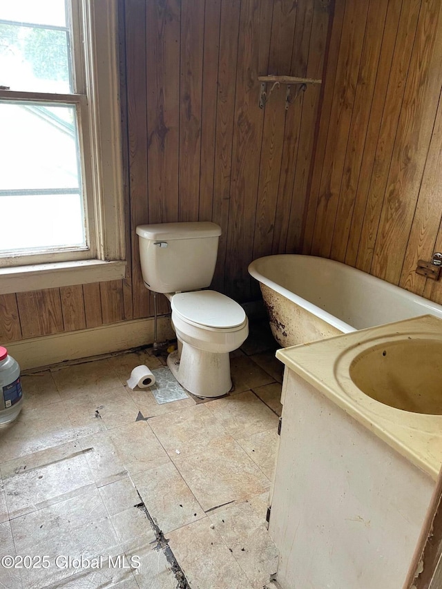 30 Washington St, Fort Plain, NY 13339 - full bathroom featuring a freestanding bath, wood walls, and vanity