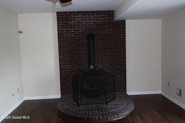 6 Galileo Way, Colonie, NY 12110 - detailed view of a wood stove, wood finished floors, and a ceiling fan