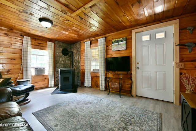 157 Mosquito Swamp Rd, Greenwich, NY 12834 - living room featuring wood ceiling, a wood stove, wooden walls, wood finished floors, and cooling unit