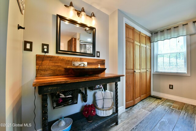 157 Mosquito Swamp Rd, Greenwich, NY 12834 - bathroom with baseboards and wood finished floors