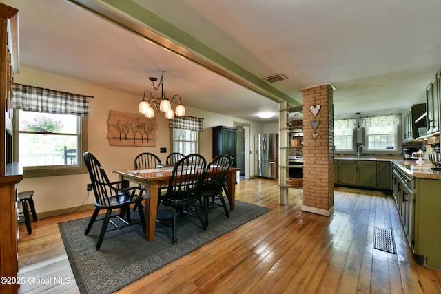 157 Mosquito Swamp Rd, Greenwich, NY 12834 - dining area featuring a chandelier and light wood-style flooring