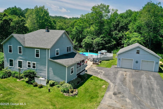 157 Mosquito Swamp Rd, Greenwich, NY 12834 - view of front facade with a shingled roof, an outdoor structure, a front lawn, and a garage