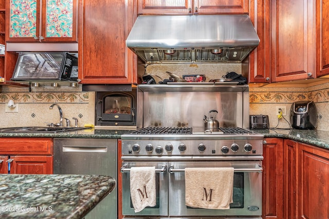2 Ash Grove Pl Unit 4, Albany, NY 12202 - kitchen featuring ventilation hood, range with two ovens, tasteful backsplash, and dark stone countertops