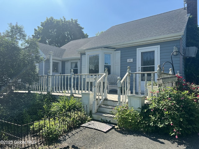 56 Wendell St, Ravena, NY 12143 - view of front of house featuring a wooden deck and a shingled roof
