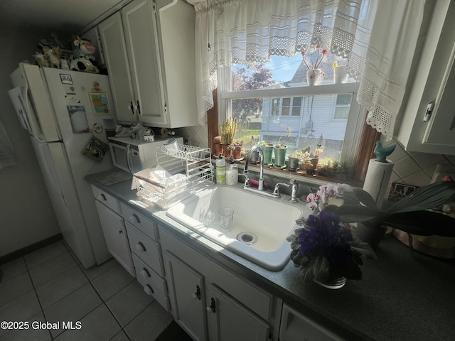 56 Wendell St, Ravena, NY 12143 - kitchen featuring white appliances, light tile patterned floors, and white cabinets