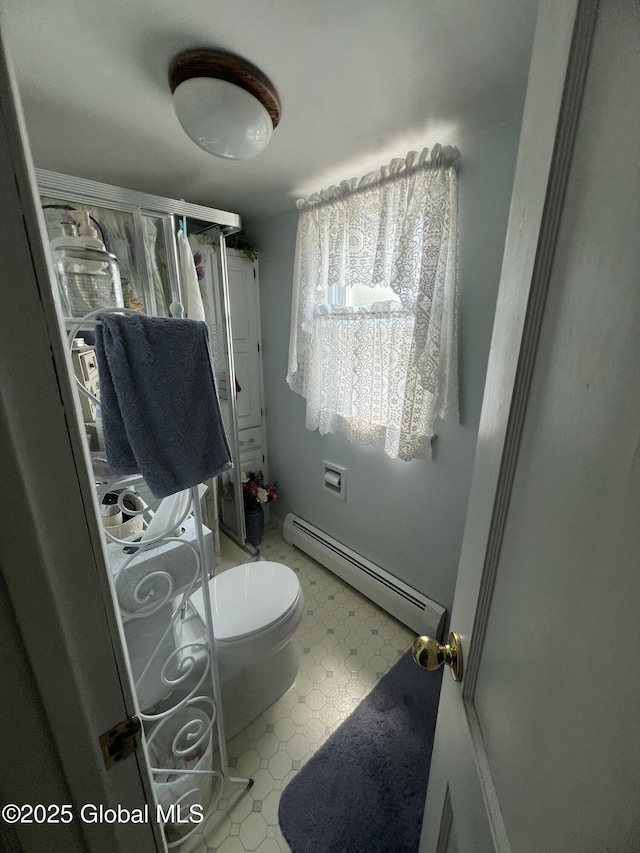 56 Wendell St, Ravena, NY 12143 - bathroom with baseboard heating and tile patterned floors