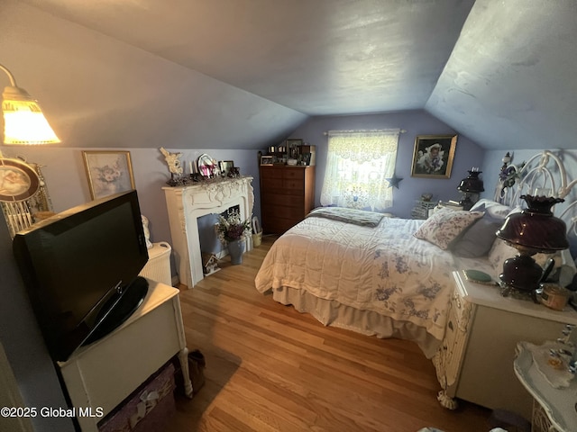 56 Wendell St, Ravena, NY 12143 - bedroom featuring wood finished floors and vaulted ceiling