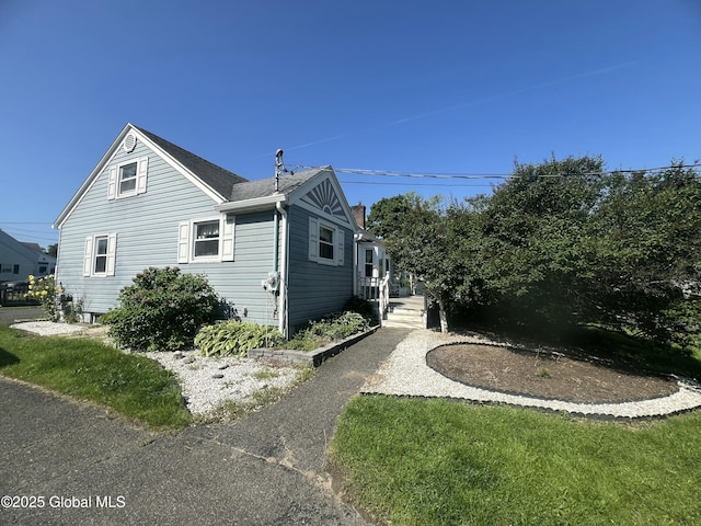 56 Wendell St, Ravena, NY 12143 - view of home's exterior with a shingled roof