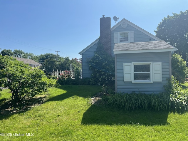 56 Wendell St, Ravena, NY 12143 - view of side of property with a chimney and a lawn