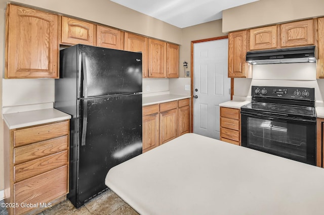 954 Obrien Ave, Rotterdam, NY 12303 - kitchen with black appliances, under cabinet range hood, and light countertops