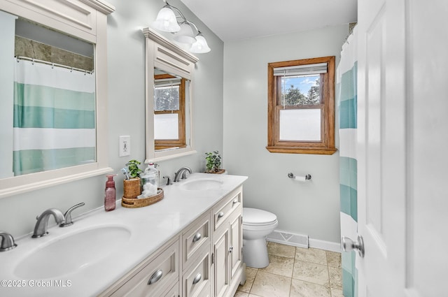 954 Obrien Ave, Rotterdam, NY 12303 - bathroom featuring double vanity and toilet