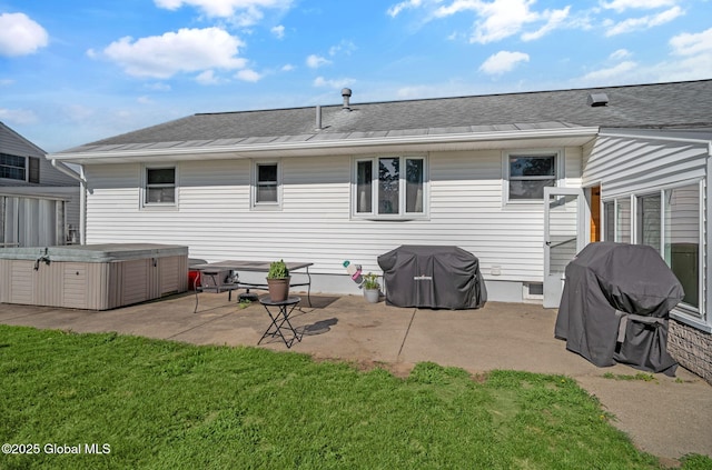 954 Obrien Ave, Rotterdam, NY 12303 - rear view of house featuring a hot tub, a patio area, a lawn, and roof with shingles
