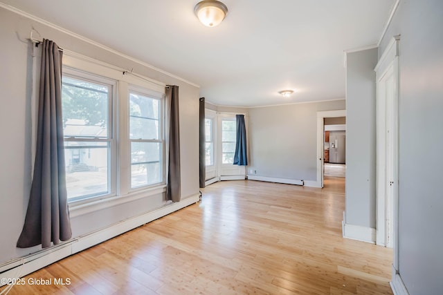 1818 4th St, Rensselaer, NY 12144 - unfurnished room featuring baseboard heating, ornamental molding, and light wood-type flooring