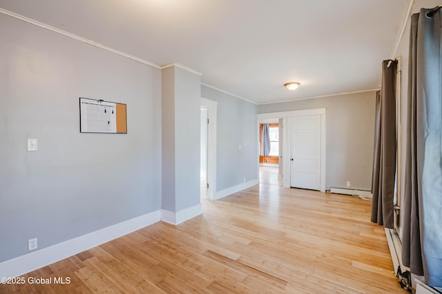 1818 4th St, Rensselaer, NY 12144 - spare room featuring ornamental molding, light wood-type flooring, baseboard heating, and a baseboard heating unit