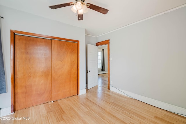 1818 4th St, Rensselaer, NY 12144 - unfurnished bedroom with light wood-style floors, a closet, ceiling fan, and ornamental molding
