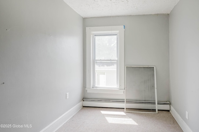 1818 4th St, Rensselaer, NY 12144 - empty room with a baseboard heating unit, healthy amount of natural light, carpet floors, and a textured ceiling