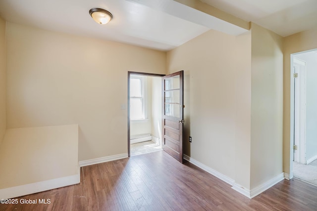1818 4th St, Rensselaer, NY 12144 - spare room featuring wood finished floors