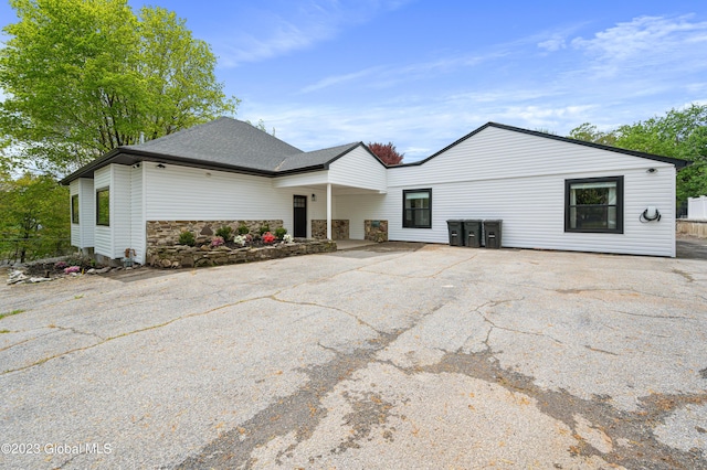 1 Wawayanda Pl, Middletown, NY 10940 - rear view of property featuring stone siding and driveway