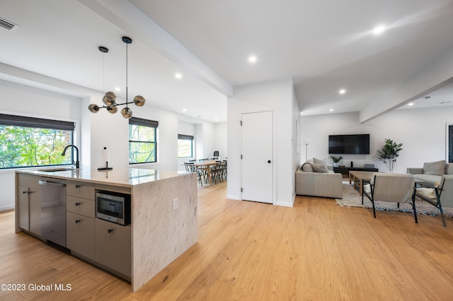 1 Wawayanda Pl, Middletown, NY 10940 - kitchen featuring stainless steel appliances, open floor plan, light wood-style flooring, a kitchen island with sink, and recessed lighting