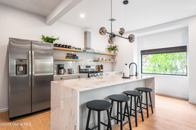 1 Wawayanda Pl, Middletown, NY 10940 - kitchen featuring appliances with stainless steel finishes, wall chimney exhaust hood, open shelves, backsplash, and light wood finished floors