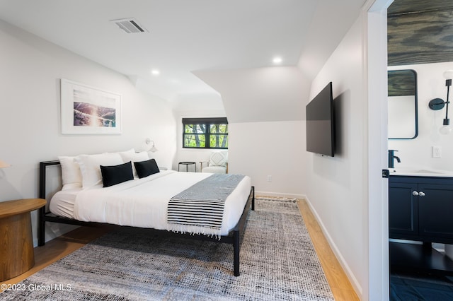 1 Wawayanda Pl, Middletown, NY 10940 - bedroom with light wood-style floors, vaulted ceiling, and recessed lighting