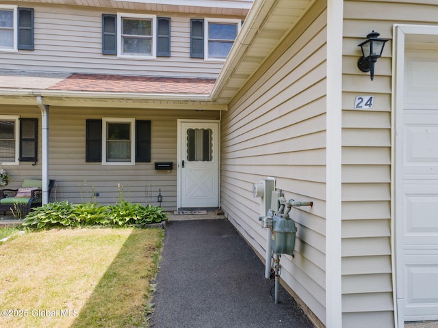 24 Esplande St, Bethlehem, NY 12158 - property entrance with a shingled roof