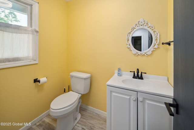 24 Esplande St, Bethlehem, NY 12158 - half bathroom featuring vanity and wood finished floors