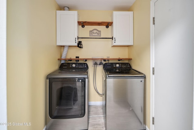 24 Esplande St, Bethlehem, NY 12158 - laundry room with cabinet space, washing machine and dryer, and wood finished floors