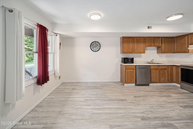 24 Esplande St, Bethlehem, NY 12158 - kitchen featuring dishwasher, range, brown cabinets, and light wood finished floors