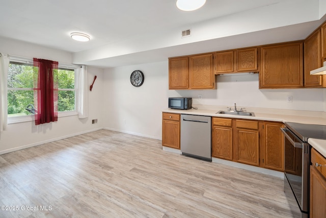 24 Esplande St, Bethlehem, NY 12158 - kitchen featuring dishwasher, range with electric cooktop, and brown cabinetry