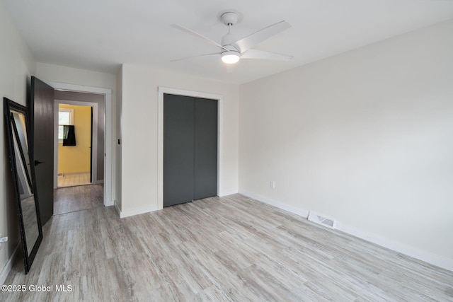 24 Esplande St, Bethlehem, NY 12158 - unfurnished bedroom featuring light wood-type flooring, a closet, and a ceiling fan