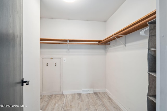 24 Esplande St, Bethlehem, NY 12158 - walk in closet with wood finished floors