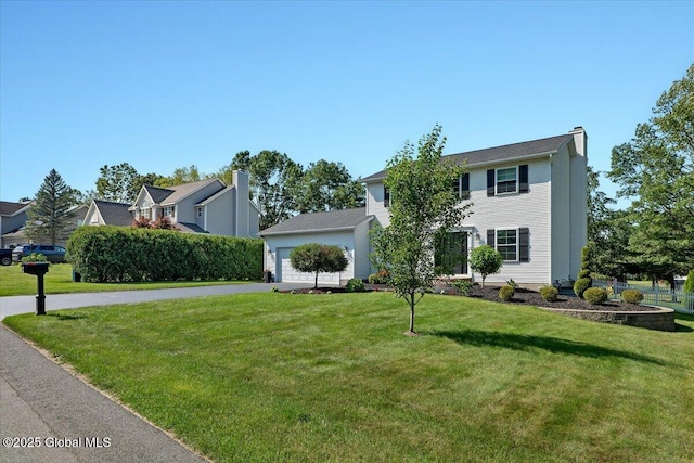 139 Country Walk Rd, Rotterdam, NY 12306 - view of front of property with a front yard, a chimney, asphalt driveway, and a garage