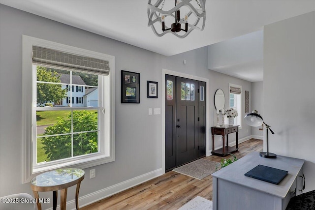 139 Country Walk Rd, Rotterdam, NY 12306 - foyer entrance featuring a chandelier and light wood-type flooring