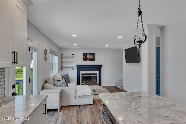 139 Country Walk Rd, Rotterdam, NY 12306 - living room featuring light wood finished floors, a high end fireplace, and recessed lighting