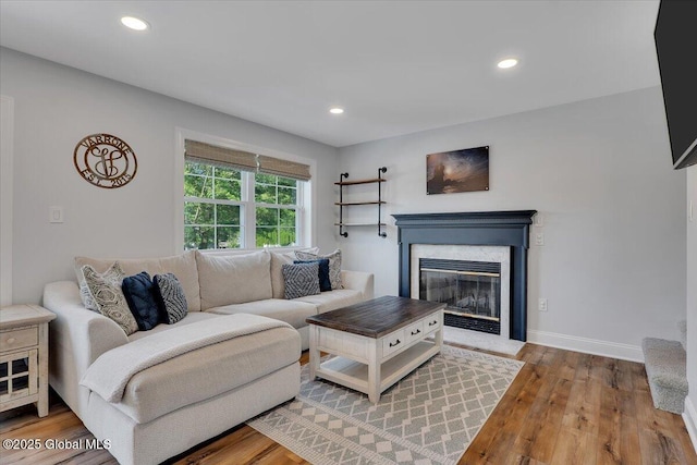 139 Country Walk Rd, Rotterdam, NY 12306 - living room with wood finished floors, a fireplace with flush hearth, and recessed lighting
