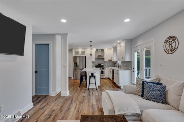 139 Country Walk Rd, Rotterdam, NY 12306 - living room featuring light wood-style flooring and recessed lighting