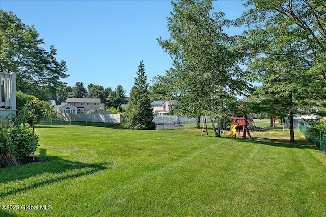 139 Country Walk Rd, Rotterdam, NY 12306 - fenced backyard with a playground