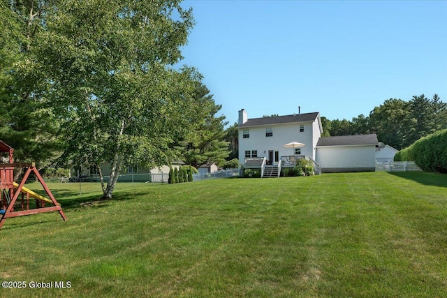139 Country Walk Rd, Rotterdam, NY 12306 - fenced backyard with a playground, a deck, and stairs