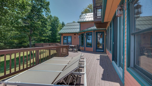 102 Taylor Ct, Mayfield, NY 12117 - wooden deck with outdoor dining space and a lawn