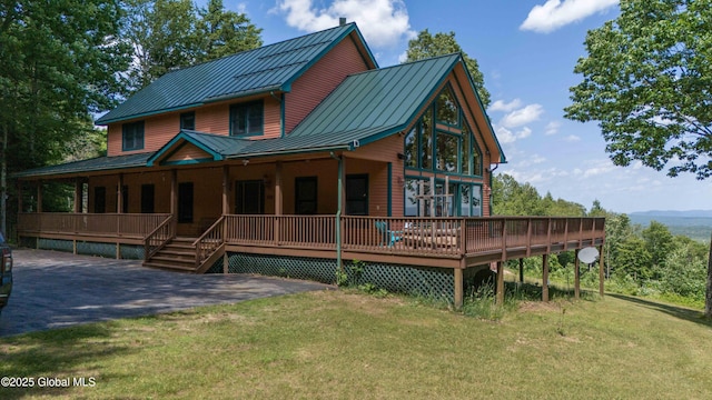 102 Taylor Ct, Mayfield, NY 12117 - view of front of property featuring a standing seam roof, a metal roof, a front lawn, and covered porch