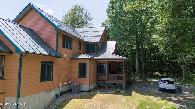 102 Taylor Ct, Mayfield, NY 12117 - back of property with a standing seam roof, a porch, and a metal roof
