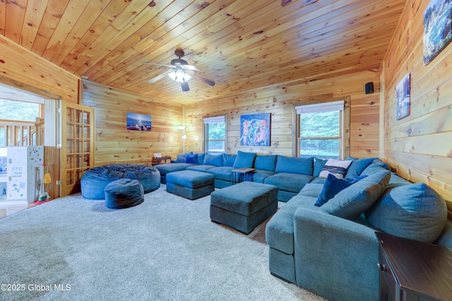 102 Taylor Ct, Mayfield, NY 12117 - carpeted living area featuring wood walls, ceiling fan, and wooden ceiling