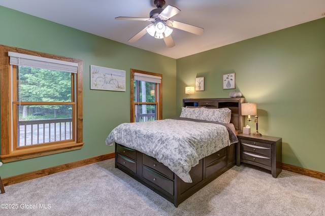 102 Taylor Ct, Mayfield, NY 12117 - bedroom with multiple windows, light carpet, and a ceiling fan